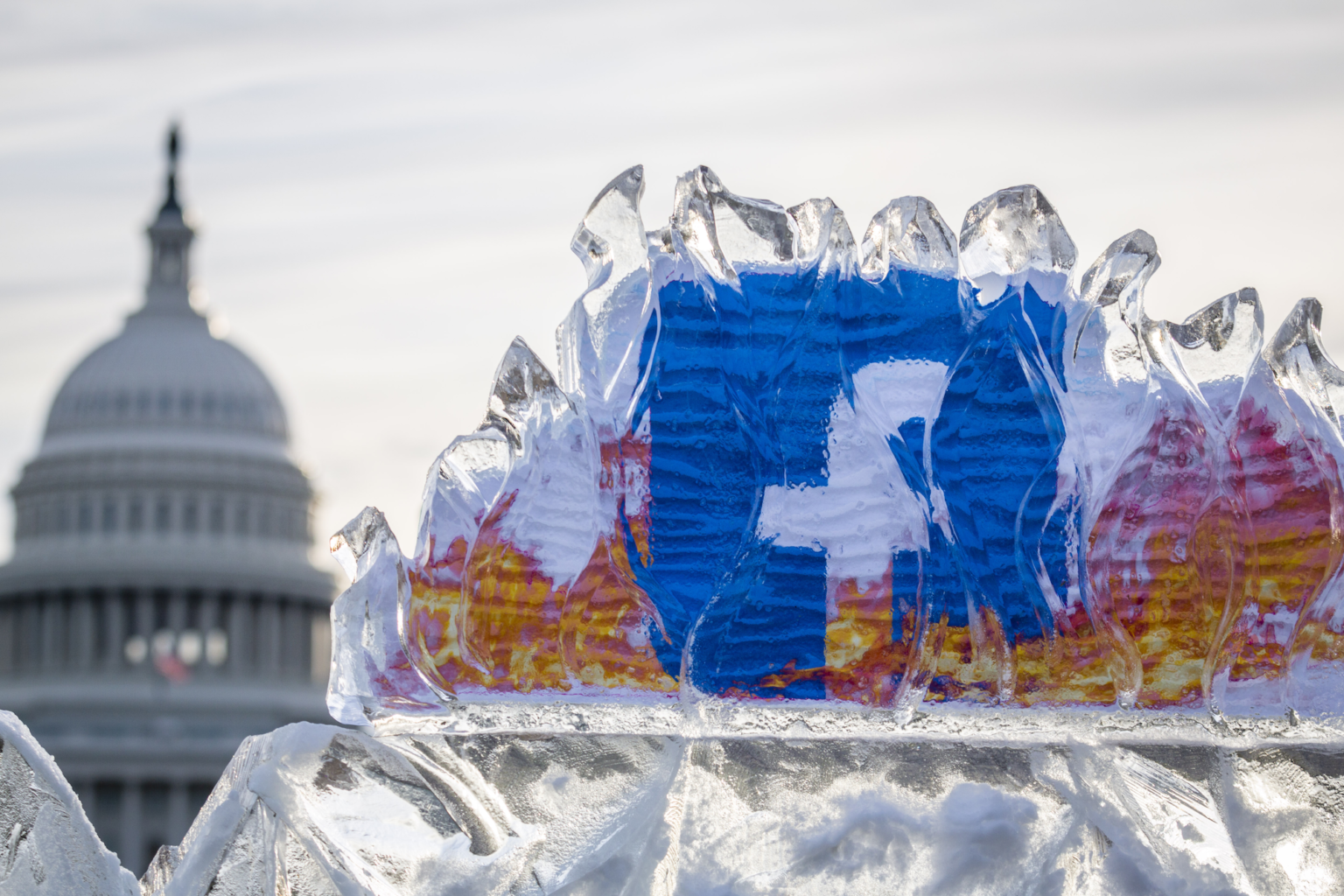 An installation of an iceberg with a burning Facebook logo near the United States Capitol, in protest of rampant climate change misinformation on the social media platform,Thursday, Nov. 04, 2021, in Washington.